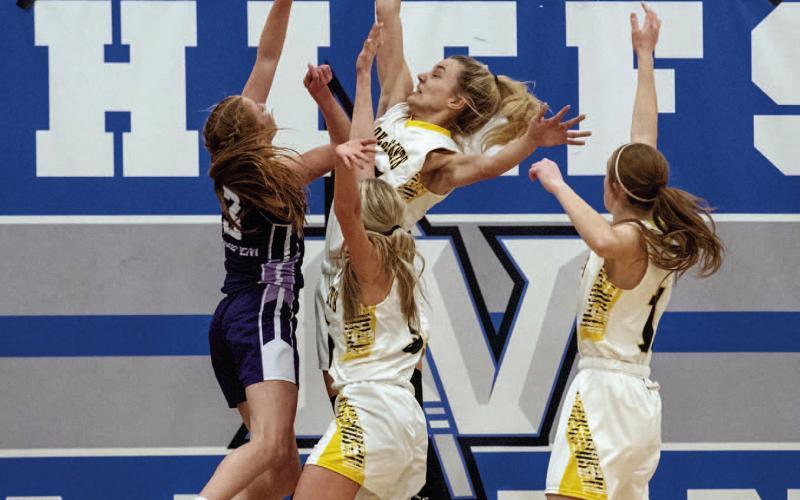 BELOW- Menard's Mackenzie Compton, center, works with Taytum Chambless and Makenzie Wright to deflect a Hornet shot during the Lady J's bi-district loss to Irion County, 24-48, eectively ending the girls' basketball season at San Angelo Lake View on Monday night. Nora Davis, photo.