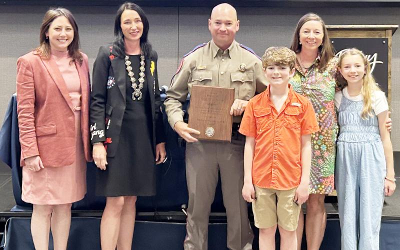 TROOPER RECOGNITION- Sergeant Lee Meadow, center, accepts his recognition from the Border Prosecution Unit (BPU) for his years-long contributions to Operation Lone Star. Meadow is stationed in Boerne. The family lives in Junction, and attend school/teach in Menard. Pictured left to right is Havana Schmidt, 452nd BPU Assistant DA; Tonya Spaeth Ahlschwede, 452nd DA and Chair of the BPU; Sergeant Lee Meadow, Jackson Meadow, Myghan Meadow, Saydee Meadow. Courtesy photo.