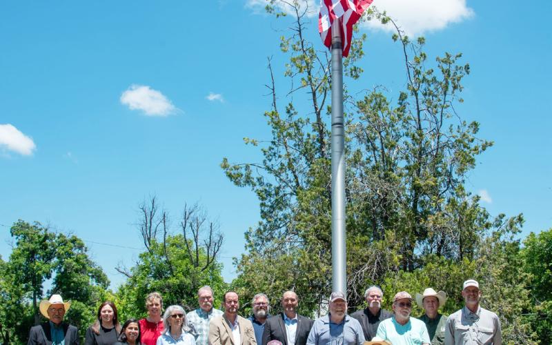 PAST &amp; CURRENT MENARD COUNTY elected officials gathered for the flag-raising and unveiling of the commemorative plaque at the courthouse. Pictured left to right: Robert Hernandez, Stacy Lawler, Cindy Cheek, Tami Russell, Ann Kothmann, Bruce Hough, Tom Roberson, Tim Powell, Brandon Corbin, Jay Cunningham, Lee Callan, Ed Keith, Burl Hagler, Tyler Wright. Bill Royal and Donald Kothmann are seated. Nora Davis, photo.