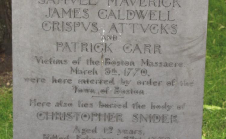 Right: The tomstone marking the grave of the 5 victims of the Boston Massacre that were buried together along with a 6th person from a previous related event. Old Granary Graveyard, Boston. Photo by Carl Lanning.