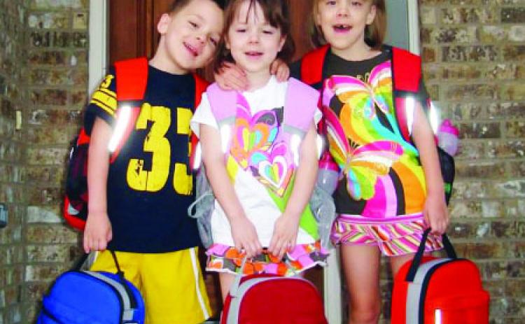 THEN... Truman, Ava and Cate Crawford on their very first day of school. Courtesy photo.