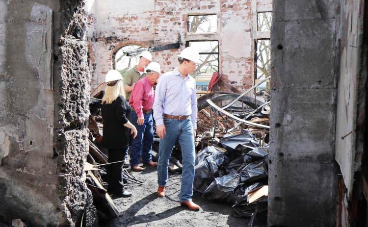 Congressman August Pfluger, front right, joined Mason County officials in touring the interior remains of the decimated Mason County Courthouse in February of 2021. Nicholas Miller, the subject accused of the arson was found guilty this week. Courtesy photo.