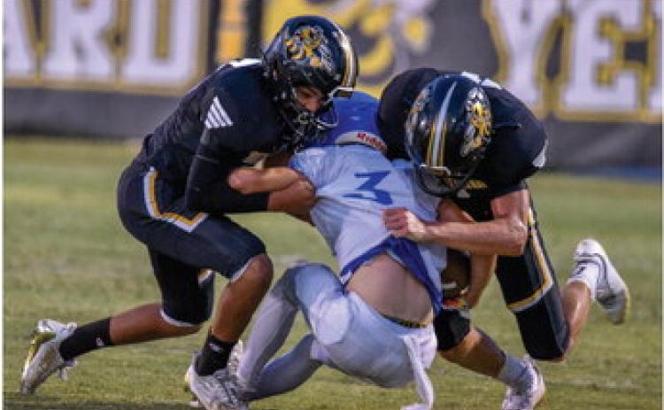 Jayden Payton and Wyatt Terrell take down a Cherokee Indian in last Friday’s game. Madolyn Nasworthy Photo.