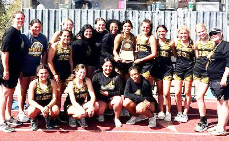 WE ARE THE CHAMPIONS- Lady Jackets tracksters claimed the District 12-1A championship by over 50 points. Pictured are, kneeling left to right: Jayla Arizola, Kendal Lawler, Audrey Mazac, Danielle Hartwick. Back: Coach Samantha Swarts, Kristen Portilla, Tatum Ruiz, Ayden Matlock, Kayleigh Zimmerman, Zoe Castleberry, Avieona Sanchez, Jalyn Montes, Makinley Kothmann, Hailey Ruiz, Korah Mayfield, Addy Bannowsky, Coach Nancy Saller