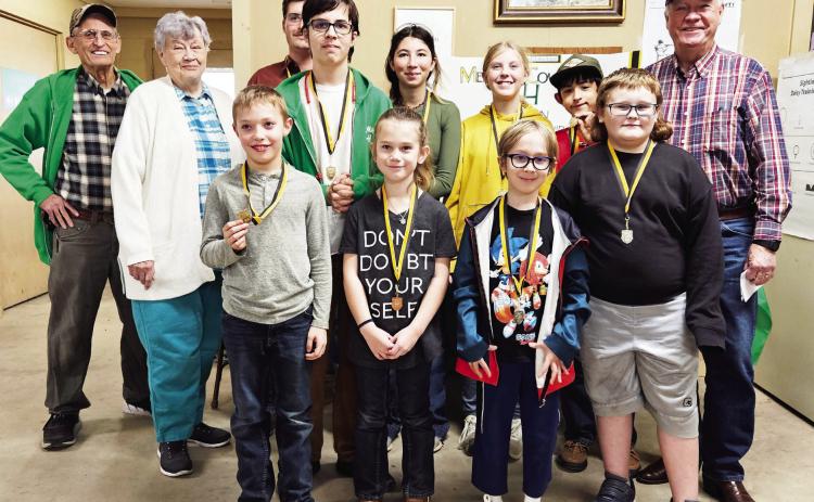 SHARP SHOOTERS at the Menard County BB Gun Match include (front row, left to right): Walker Hines, Kylie Smith, Turner Thigpen, Kobe King. Back row: Coach David Hand, Betty Jackson, Larkin Loeffler, Jackson Thigpen, Mia Estrada, Caitlyn Burch, Mason Mireles, Coach Terry Kelley. Courtesy photo.