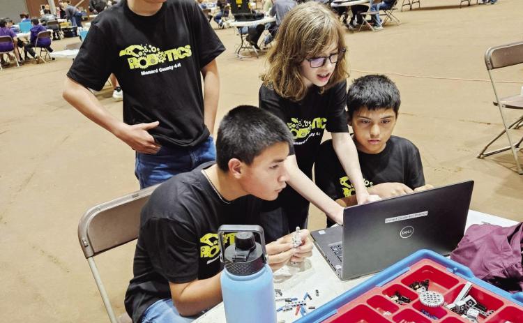 BELOW- Roy Mews, Ayden Cardenas, Barret Thigpen and Isidrio Valdez, of Menard’s junior ag-robotics team, work together during the San Angelo competition. Courtesy photo.
