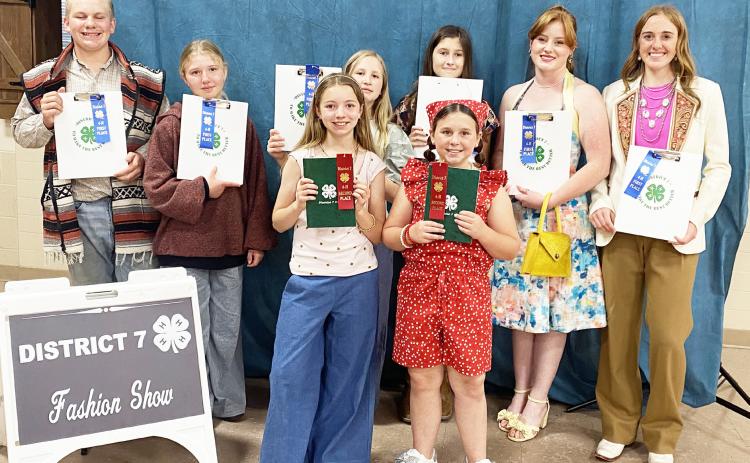 A FASHIONABLE LOT of Menard 4-H sewing participants ruled the roost at the district 7 fashion show last Wednesday. Pictured back row, left to right: Tanner Brown, Daphne Mews, Georgina Mobley, Audrey Wilkinson, Jacey Sealy, Makenzie Wright. Front row: Saydee Meadow, Ellen Hand. Photo courtesy Menard Co. 4-H.