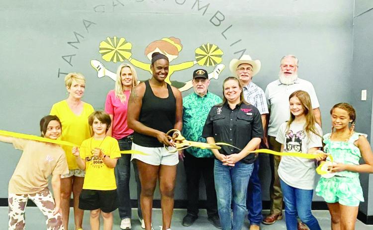 FLIPPN' OUT- Menard County Chamber of Commerce's newest member, Tamara's Tumbling &amp; Cheer, celebrated recently with a ribbon cutting. Pictured left to right, front- tumblers Lily Torres, George Corbin. Second row- Cherry Swindall, Chamber Executive Director; Jessica Elkins, parent of tumbler; Tamara Hernandez, owner/operator; Dean Mayhew, MIDC; Christy Eggleston, Chamber and MIDC; Lee Thornhill, Chamber; Randel Blesing, Chamber; tumblers Claire Corbin, Nayeli Hernandez. Courtesy photo.