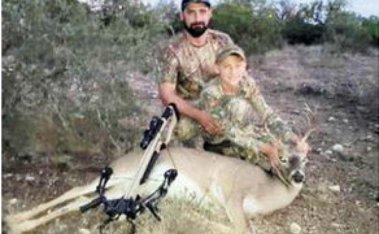 LEFT- Tony Bree, left, took stepson Eli Janke hunting this fall at Menard’s Luchenbach Ranch. They are pictured above with one of the cull bucks Eli took. Brent Crawford, photo.