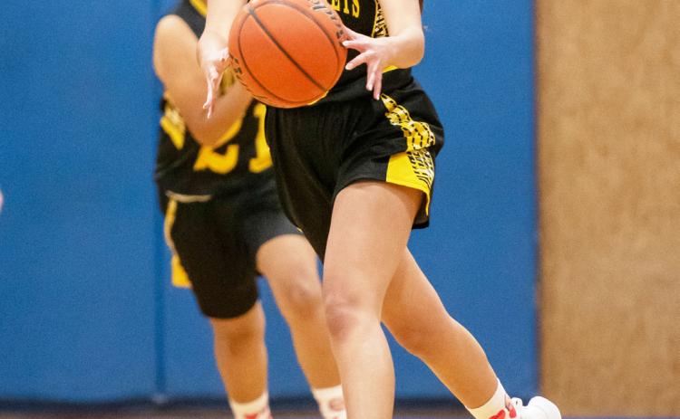 Lauren Guerrero works the ball down the court in Olfen.