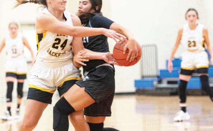 Lady Jacket Makinley Kothmann fi ghts for the ball against Water Valley on Tues