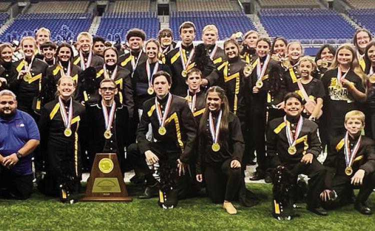 BELOW- The Menard Yellowjacket Band members with all their support staff and bus driver on the Alamodome fi eld after winning their second state championship. Courtesy photo