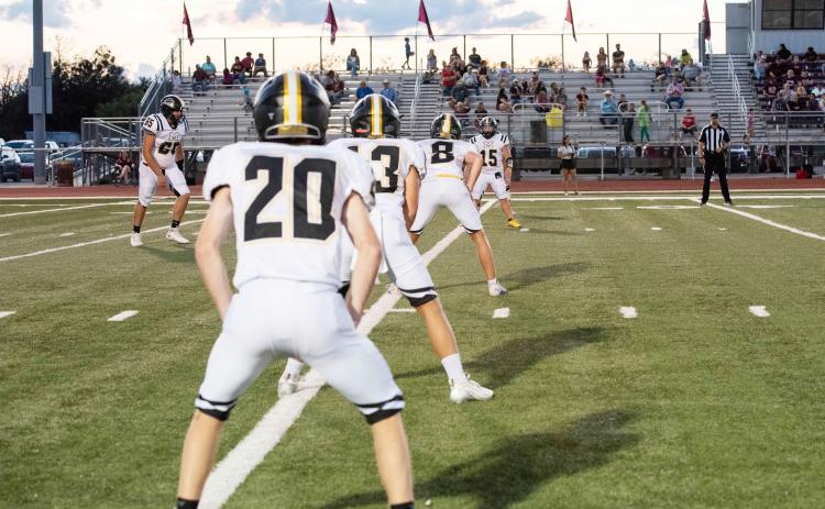 Menard's Bryce Davis (20), Hunter Squiers (13), Logan Powell (8) and Korbin Squiers (15) line up for an Aidan Ramon (65) kickoff during the the Jackets' 47-18 win over Bronte last week. Nora Davis, photo.