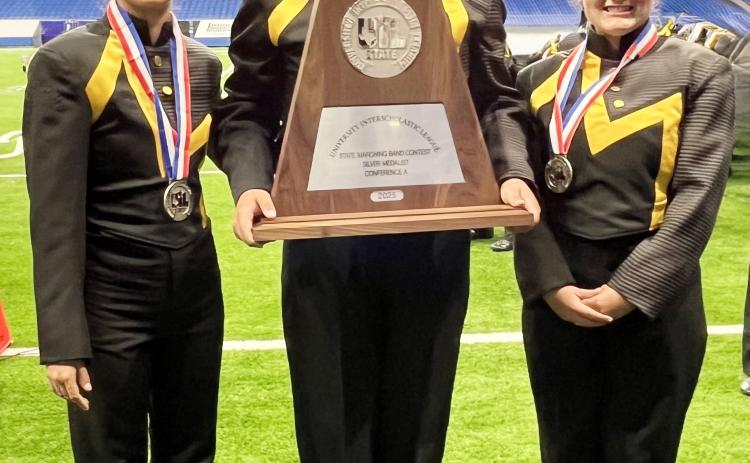 ADD A SILVER TO THE TROPHY CASE- Yellowjacket marching band drum majors Lorelei White, Tristan Wilson, and Kailey Morris proudly display their silver medals and plaque from the UIL State Marching Band Championships on Tuesday. TMN photo.