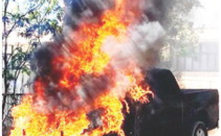 HOT STUFF- A dark gray Ford F150 pickup was a total loss after it was engulfed in flames shortly after being parked last week. The fire was quickly extinguished and there were no injuries. Photo Courtesy Menard County S.O.