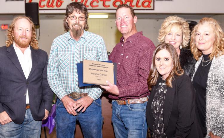 WELL DESERVED- Menard’s Wayne Carlile, second from left, accepts his Citizen of the Year award from Menard County Chamber of Commerce directors (left to right) Cody Swindall, (Carlile), Clint Roberson, Cherry Swindall, Kimberly Powell, and Jessica Rayburn (front). The annual Chamber banquet was held Friday evening, March 11, 2022. Madolyn Nasworthy, photo.