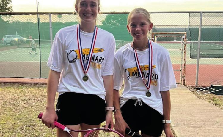 Makenzie Wright (l) and Taytum Chambless won 1st place in girls doubles at the district meet. Nora Davis Photo.