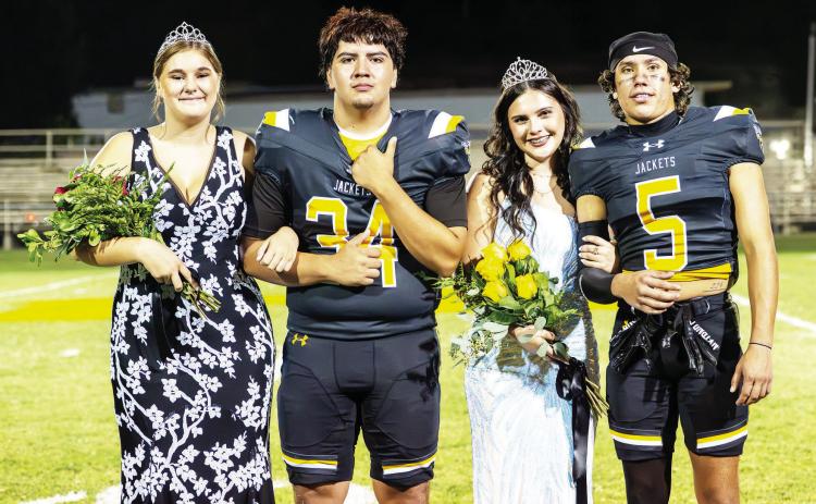 HOMECOMING ROYALTY- Newly crowned Band Sweetheart Kylee Sommerville, left, with her escort Joseph Garcia, stand alongside the new Football Queen, Sabri Zamora, with Marlee Salas after the ceremony following the Jackets’ 78-0 homecoming win over Paint Rock. See more on the homecoming court on pages 9 and 10. Nora Davis, photo.