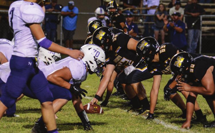 SET HUT! The Yellowjacket offensive line faces the Cross Plains Buffaloes. Pictured are, right to left: Amos Hesbrook (#50); Ulises Osornio (#65); Gavin Johnston (#52); Jonathan Saucedo (#51); Jimmy Morris (#67). Menard lost to Cross Plains 14-33, in a contest mired by lighnting delays. Sandy Kothmann, photo.