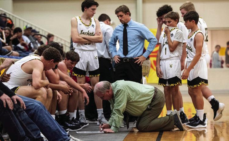 Coach Campbell is “ALL IN” when it comes to coaching his team, even if it involves getting down on the floor to draw plays during a re-grouping session.