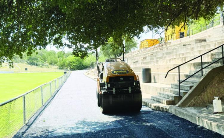 The ASCO Equipment roller was used to put the finishing touches on the new walking surface at Findlay Field. TMN, photo.