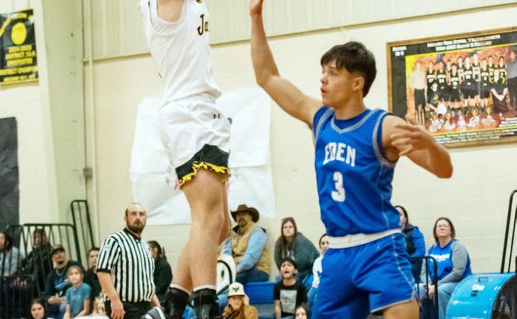 ABOVE- Eli Weatherly shoots over an Eden defender in the Jackets' 43-41 overtime win on Jan. 9. RIGHT- Sabri Zamora works for the ball during the Jan. 9 Lady Jacket victory over the Eden Lady Bulldogs.