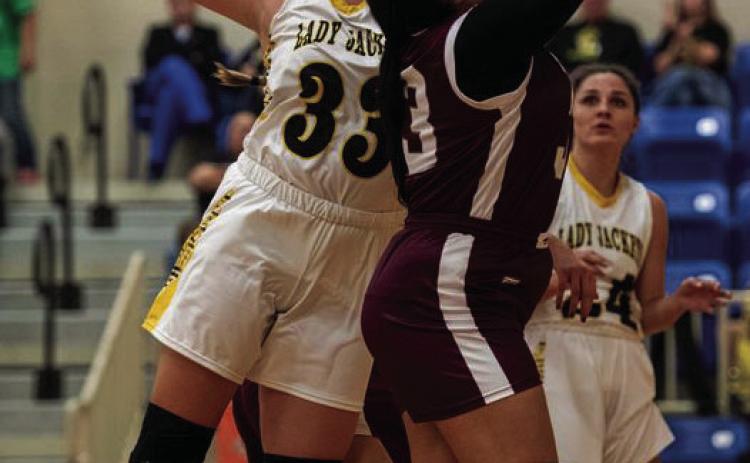 Senior Zoe Castleberry works for the rebound.