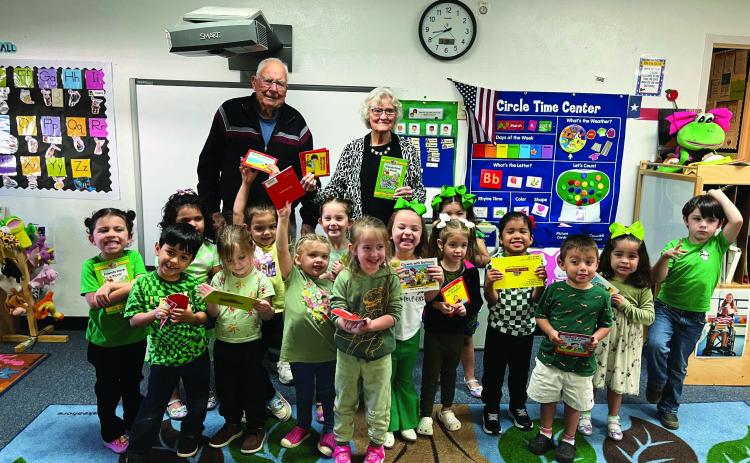 John and Katherine Kniffen presented books to each the young Menard students. The books were provided by Menard-Kimble-Mason Retired Teacher Association.