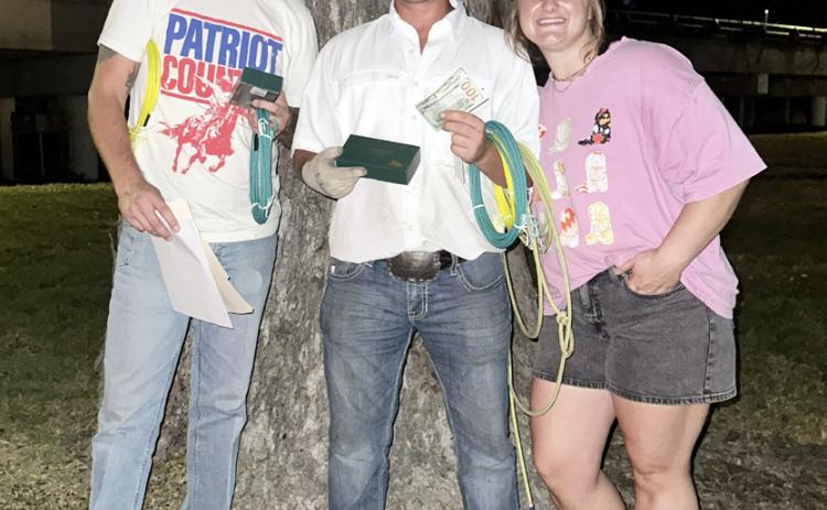 HOCO Benefit Goat Roping Champions Wade Johns and Ty Titzman with Ag Sciences teacher Macie Smith.