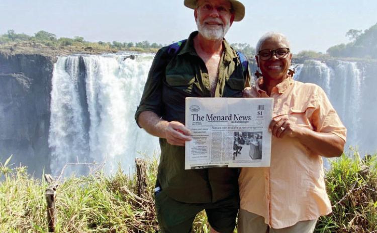 TMN SPOTTED IN AFRICA- Dave and Delise Rohret did not let a recent trip to Africa get them behind on local news. Here they are pictured with The Menard News at one of the viewing stations on the Zimbabwe side of Victoria Falls, across from the country of Zambia. Thanks for thinking of us, Dave and Delise!