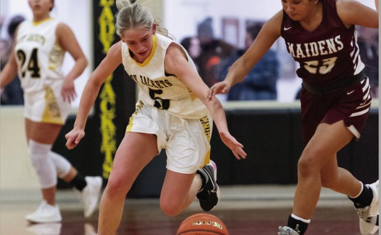 Menard freshman Taytum Chambless, center, out works and runs down a Paint Rock Maiden during the Lady Jackets' 94-5 scalping of Paint Rock last Friday. Teammate Perla Pecina is pictured in the background. Nora Davis, photo.