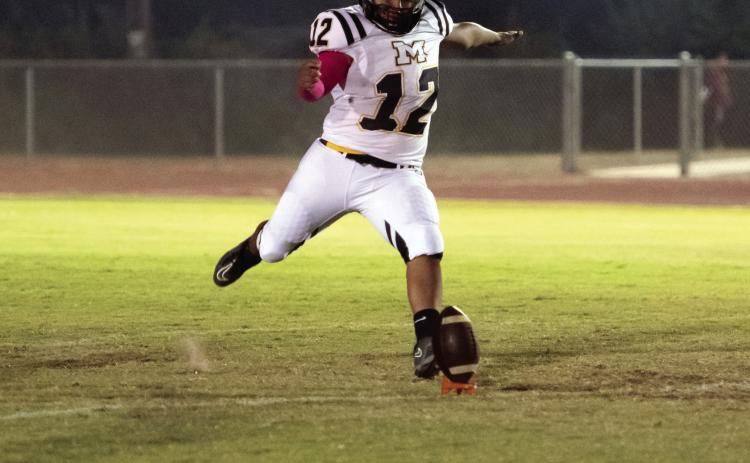 CALLED UP- Freshman Yellowjacket Dario Gonzales stepped up big last Friday in his first ever varsity appearance. The consistent kicker is a part of the high-scoring, record-breaking JV squad of underclassmen. He has been called up to fill the kicking position on Friday nights, and had a respectable first showing, recording four of six on extra points kicks. Gonzales was also bestowed the 'Psycho' award, which goes to the special teams player of the week. Nora Davis, photo.