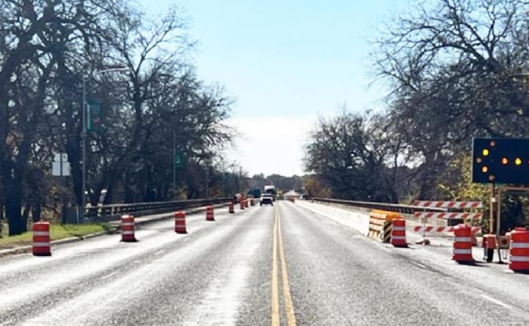 LEFT- The Highway 83 bridge through Menard, looking southbound. Concrete barriers and barrels are up, constricting lanes from 4 to 2 lanes as construction crews begin a rehabilitation project. TMN photo.