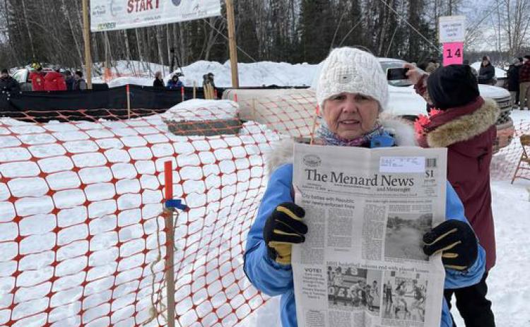 Menard's Dora Wright was in Alaska recently for the ceremonial start of the 52nd running of the Iditarod Sled Dog Race. She packed all of the essentials- gloves, longjohns, a copy of The Menard News... Wright began her interest in sled dogs and racing with an Alaskan mushing trip of her own last year. Courtesy photo.