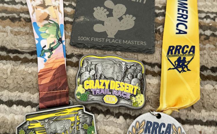 LEFT- Sandy Kothmann's award haul after winning the womens' master division of Saturday's Crazy Desert 100k Trail Race in San Angelo. Courtesy photo.