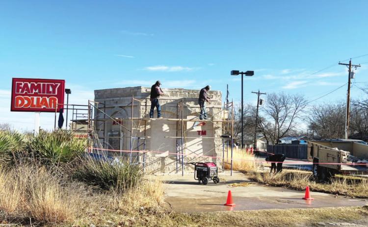 Local masonry crews work to dismantle the abandoned drive-thru ATM structure on the corner of Highway 83 and Travis Street. Menard’s Parent-Teacher Organization (PTO) has purchased the lot. The dismantled rock will be repurposed into a digital sign structure for MISD. TMN photo.