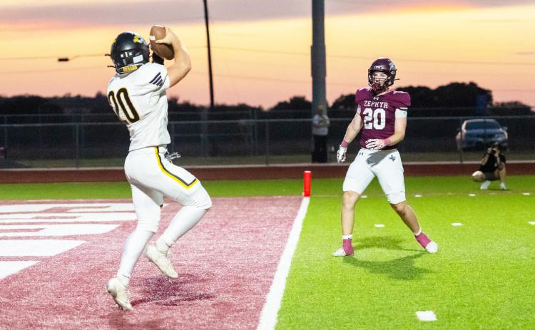 MENARD’S ASHTON MARTIN snags a PAT after a rogue snap to kick the points forced Julius Zamora to pass. The Jackets came out on top over Zephyr last Friday, 59-14. Nora Davis, photo.