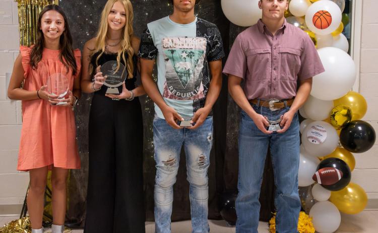 TOP BANQUET HONORS went to (left to right): Hailey Ruiz, Fighting Heart Award female; Addy Bannowsky, Athlete of the Year female; Isaiah Stanislawski, Athlete of the year male; Joel Guerrero, Fighting Heart male. Nora Davis, photo.