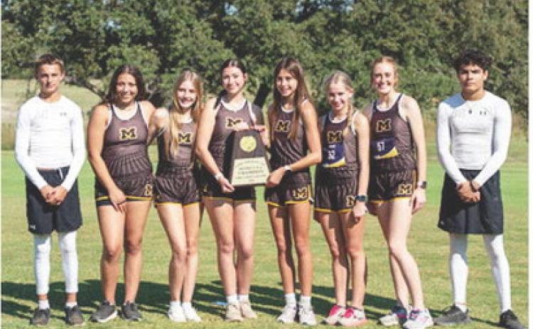 CLEANIN' UP on the course was the Lady Jacket cross country team. Pictured left to right- Yellowjacket Jaegar Leonard; Lady Jacket District Champs: Perla Pecina, Kaitlyn Whitaker, Kendal Lawler, Danni Ruiz, Taytum Chambless, Makenzie Wright; Yellowjacket Floyd Teague. Photo by Nora Davis.