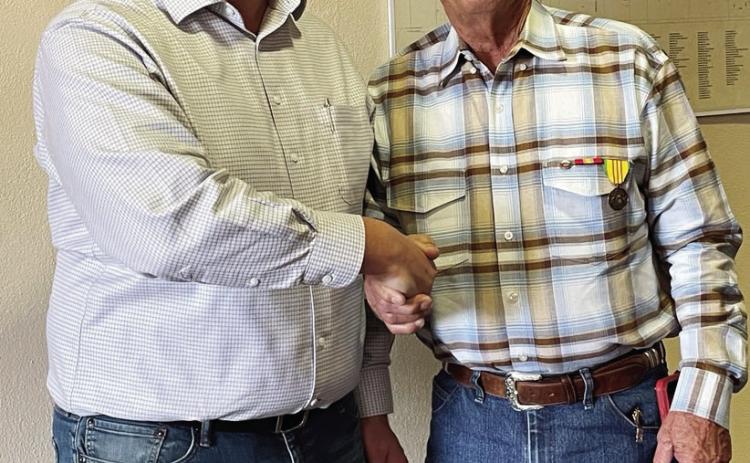COMBAT CITATION ISSUED- Menard County Judge Brandon Corbin, left, congratulates Navy veteran Jimmy Brooks for his national commendation during Brooks's service aboard the USS Bon Homme Richard in the Vietnam War. Courtesy photo.