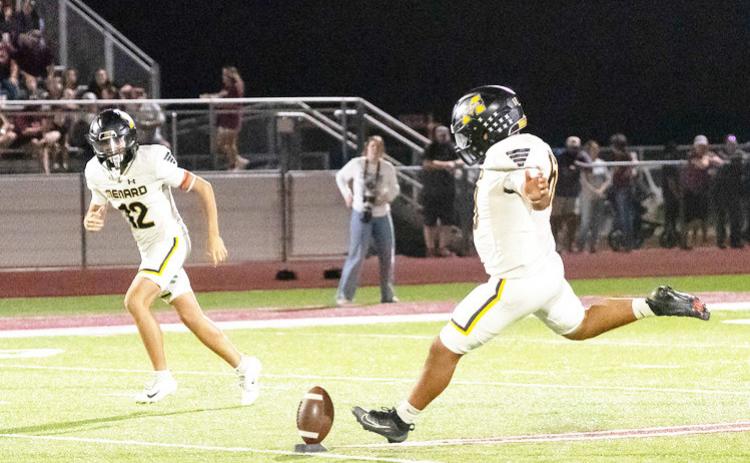 Dario Gonzalez, with River Salas nearby, kicks off during the Jackets’ 59-14 win over Zephyr last Friday. Gonzalez was 5/5 on PATS and added 4 touchbacks.
