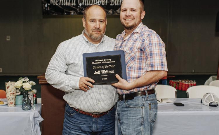CONGRATULATIONS to Menard Emergency Management Coordinator (EMC) Je Whitson, left, on receiving the distinguished Citizen of the Year Award at the Chamber of Commerce's annual banquet last week. Chamber board member Tyler Wagner, right, presents the plaque. See page 8 for additional awards. Raque Guerrero, photo.