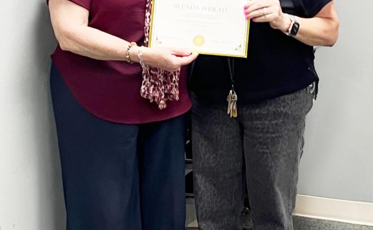 BELOW- Child Welfare Board president Cordelia Kothmann, left, recently presented board member Blenda Wright with a certificate of recognition for her 6 years of service with the organization. TMN photo.