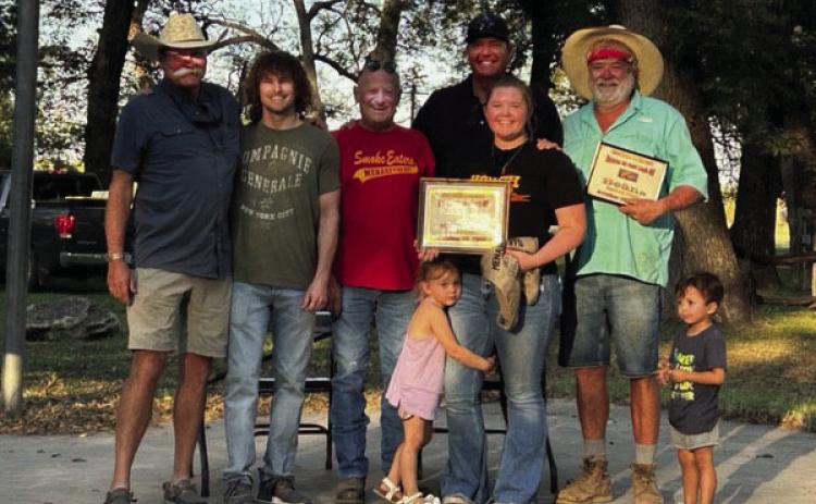 The Hough Brothers team won 1st place in the Bloody Mary and Mystery Dish competitions. They also brought home 2nd in Poppers, Hot Wings, and 3rd in Chili. Pictured (l to r) - Bruce Hough, Jessup Hough, Curley Wagoner, Joe Hough, Jamie Hough with Emily Flores hugging her leg, Tommy Hough, and Caleb Flores. Courtesy Photo.