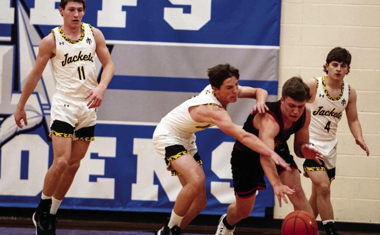 THIS PHOTO SUMS UP the Jackets' bi-district loss against Garden City on Monday. The Jackets worked hard but never managed to overtake the Garden City Bearkats, taking the 59-41 loss. Sandy Kothmann, photo.