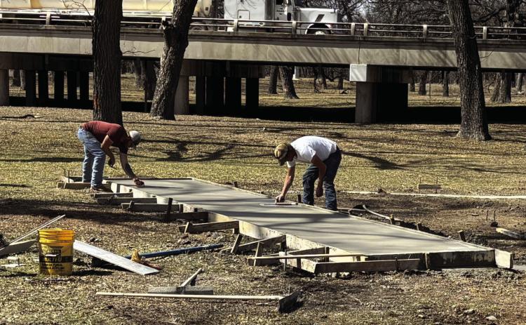 IN THE BEGINNING there is a concrete footer to support the city's permanent outdoor stage at Low Water Park. Construction crews continue to make progress and the facility should be ready to use in June.