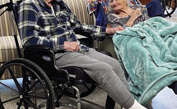 Many will recognize these two former Menard High School classmates and lifelong friends. Carl Kothmann and Litane Landers Kothmann were able to catch up recently during some deep conversation at Menard Manor. Photo courtesy Menard Manor Facebook page.