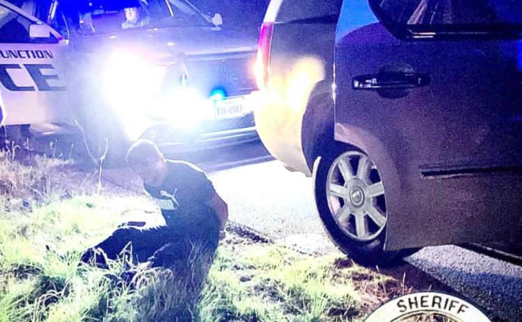 One of 5 high-speed chase-turned-bailout suspects sits upon the side of US HWY 83 in the early morning hours of Sunday, May 15, 2022. Two suspects were arrested immediately by Kimble County agencies, and three more were apprehended by Menard SO near Menard the next day. Photo courtesy KCSO Facebook page.