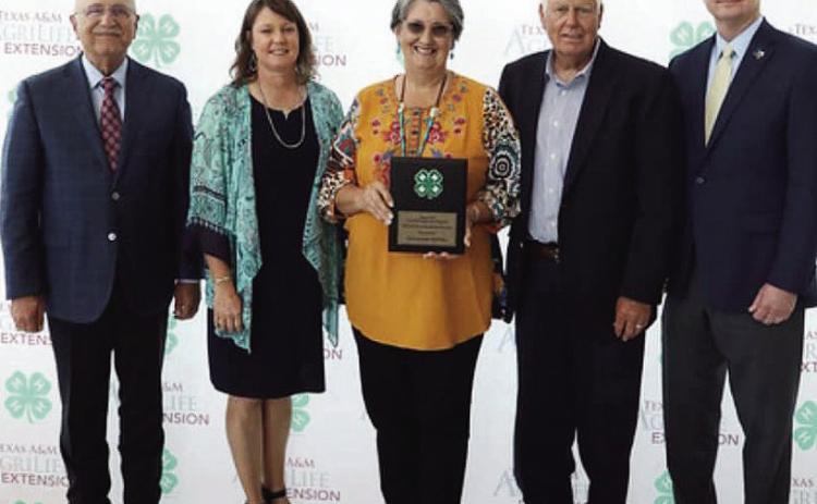 SALUTE TO EXCELLENCE- College Station and Texas A&amp;M was the site of the 2023 Texas State 4-H Roundup last week. While many local 4-H members competed and were recognized, volunteers Mary and Billy Kniffen were awarded the Salute to Excellence Award. Pictured left to right: Dr. Jeffrey W. Savell, Vice Chancellor and Dean of Agriculture &amp; Life Sciences; Lisa Brown, Menard County AgriLife Extension Agent; Mary and Billy Kniffen; Dr. Rick Avery, Director of AgriLife Extension. Courtesy photo.