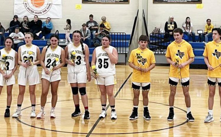 MHS SENIOR BASKETBALL PLAYERS were recognized Tuesday night when the Jackets faced off against Santa Anna. The Lady Jackets smoked the Lady Mountaineers 59-21 to finish out their season as Co-District Champions. The boys came from behind to also beat Santa Anna 45-31. Senior players pictured left to right: Hailey Ruiz, Cozette Halley, Makinley Kothmann, Zoe Castleberry, Kristen Portilla, Kade Rayburn, Wyatt Terrell, Aydan Wilson. Jessica Rayburn, photo.